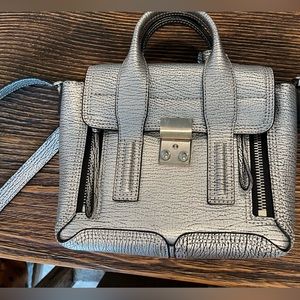 3.1 Philip Lim mini Pashli leather satchel. Rolled leather top handle.
